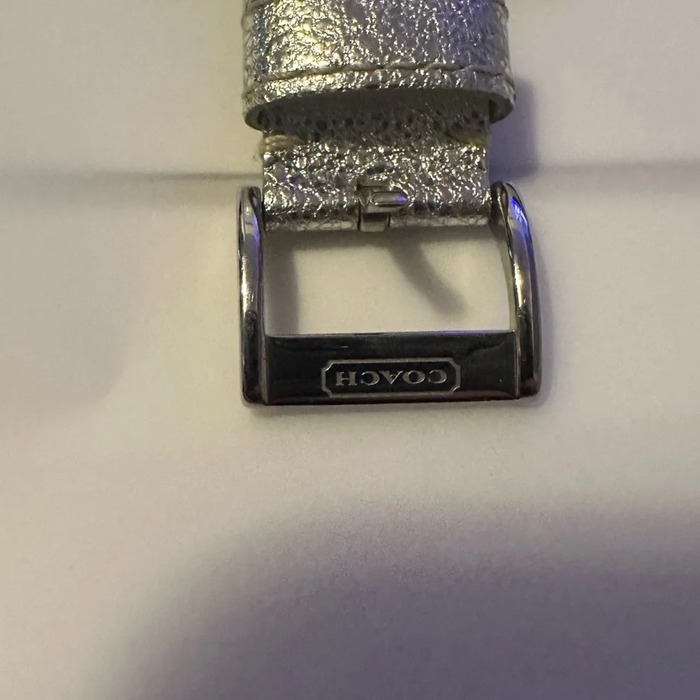 Coach Poppy cuff watch. Genuine leather with silver‎ metallic design. Vintage